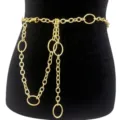 Gold metal waist chain featuring interlocking oval rings and delicate links. Detail shot. - Gold