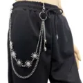 Close-up of a multi-layer punk metal waist chain with sun and skull charms on black pants. - Sun Smiley Face Double-Layer Wallet Chains