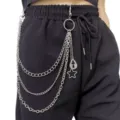 Detail shot of punk multi-layer metal pants chain with cross and star charms for hip hop style. - Cross and Star Multi-Layer Pants Chain / Cross and Star Multi-Layer Pants Chain