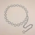 Detailed view of a trendy silver star metal waist chain, perfect edgy body jewelry. - 21 Pentagram Waist Chain / Silver