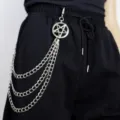 Detail view of punk style multi-layer metal pants chain with pentagram pendant on black trousers. - Star Multi-layer Pants Chain / Silver
