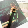 Detailed close-up view of a stylish women thin black belt featuring a vintage gold heart metal buckle. - Black