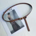 Women's thin brown leather belt with metal buckle and stylish knot design for casual daily wear. - Camel
