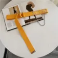 Yellow canvas belt for women with metal double ring buckle, chain, and transparent tag. - Yellow
