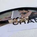 Elegant black thin waist belt featuring gold chain buckle, ideal for dresses and suits. - Black