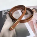 Elegant brown leather belt with gold-toned rectangular buckle, fashionable women's waist accessory. - Camel