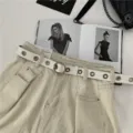 Stylish women casual white PU leather belt featuring metal grommets and round pin buckle. - White