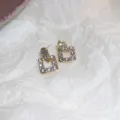 Detailed close-up shot of elegant gold-toned square geometric earrings sparkling with stones. - 10# Gold Full Pave Rhinestone Geometric Square Style