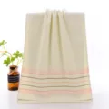 Pure cotton face towel in beige with colorful stripes, soft and durable for daily use. - Polka Dot Yellow