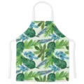 Kitchen cooking apron with green tropical leaf print, sleeveless bib style, white straps. - Kids One Size / Letter D