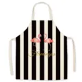 Black and white striped apron featuring pink flamingos and gold text, kitchen cooking bib. - Flamingo
