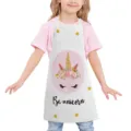 Kids unicorn print cooking apron, white fabric with pink floral unicorn design and text. - Kids One Size / Style E