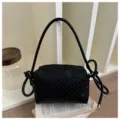 Black woven leather shoulder bag crossbody camera bag with stylish knotted strap details. - Black