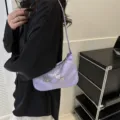 Trendy minimalist purple underarm shoulder bag for women with chic silver butterfly chain design. - Purple