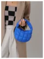 Blue quilted cloud handbag, stylish mini puffer tote bag with soft padded texture and handle. - Blue