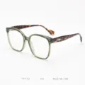 Detailed view of large frame optical glasses with olive green front and tortoiseshell temples. - Green Frame with Tortoise Temples C4