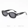 Black oval frame sunglasses detail view featuring stylish chunky design and metal temple accent. - Glossy Black Full Gray C1