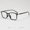 Detail view of lightweight TR90 optical glasses frame in black, modern retro style. - Glossy Black C1