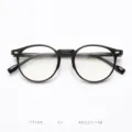 Detailed view of black round TR90 optical glasses frame, lightweight retro eyewear design. - Glossy Black C1
