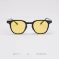 Close-up of black frame sunglasses with yellow lenses, stylish optical details and precise specs. - Glossy Black with Yellow Lenses C2