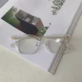 Detail shot of the clear TR90 optical glasses frame with fine gold metal temples. - Transparent White and Gold C2