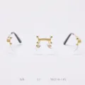 Detailed view of vintage rimless glasses with exquisite gold bridge and sleek metal temples. - 18K Gold Clear Lens C1
