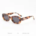Detailed view of trendy TR90 tortoiseshell oval sunglasses with metal temple accent for daily wear. - Tortoise Full Grey C3