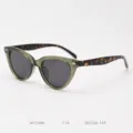 Detail view of stylish cat-eye polarized sunglasses with olive green frame and tortoiseshell temples. - Green Frame with Tortoiseshell Temples C14