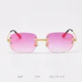 Detailed view of frameless sunglasses with pink gradient lenses and golden metal bridge. - 18K Gold Red Coating C40