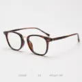 Detail view of vintage tortoise shell optical glasses frame, metal bridge, elegant daily wear. - Tortoise / Gold C3