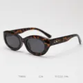 Retro tortoise shell oval cat eye polarized sunglasses with chic metallic temple detail. - Tortoiseshell C26