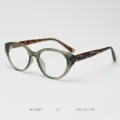 Detailed view of retro cat-eye eyeglass frame with stylish tortoise temples and chic color. - Green Frame with Tortoiseshell Temples C7