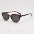 Detailed view of fashionable tortoise shell cat-eye polarized sunglasses, elegant frame. - Tortoiseshell Frame Grey Lens C11