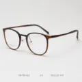 Detailed view of brown round optical eyeglass frame, lightweight plastic steel design. - Brown Tea
