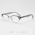 Detail view of stylish retro browline glasses frame with metal and acetate materials. - Transparent Gray C2