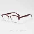 Detail view of the vintage semi-rimless eyeglass frame in wine red and silver finish. - Ankara Red C5