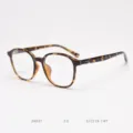 Detail view of the tortoise shell TR90 optical glasses frame, featuring round design and specs. - Tortoiseshell C3