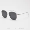 Detailed view of metal polygon sunglasses frame, stylish vintage design with dark lenses. - Silver Frame Grey Lens C4