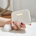 White short wallet for women, elegant heart embossed PU leather with cute pom-pom pendant. - White