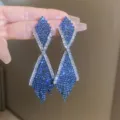 Stunning long rhinestone tassel earrings featuring blue and white crystals for women fashion style. - Gunmetal Blue - Claw Chain Tassel