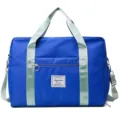Large capacity travel duffel bag in vibrant blue with contrast light green straps. - Klein Blue
