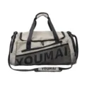 Large capacity gym duffel bag in beige with black straps and shoe compartment for travel. - Khaki