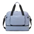 Grand sac de voyage pliable bleu clair avec séparation sec humide et compartiment inférieur. - Bleu