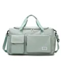 Mint green nylon travel duffel bag with separate shoe compartment and multiple pockets. - Light Green