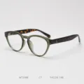 Detail view of retro cat-eye TR90 eyeglasses frame in olive green with tortoise temples. - Green Frame with Tortoiseshell Temples C7
