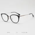 Detailed view of fashionable cat-eye optical glasses frame with slim metal and acetate. - Bright Black Gold C2