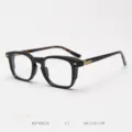 Vintage acetate optical glasses frame detail shot, classic black frame, stylish everyday wear. - Glossy Black with Tortoiseshell Temples C1