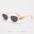 Detail view of trendy polygonal sunglasses featuring transparent frames and gradient orange temples. - Transparent Frame with Orange Temples C2