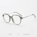 Close-up detail of stylish TR90 clear green optical eyeglass frames with slim metallic temples. - Grass Green Grey C7