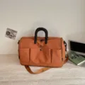 Large capacity travel duffel bag in orange brown, canvas multi-pocket gym and overnight bag. - Orange